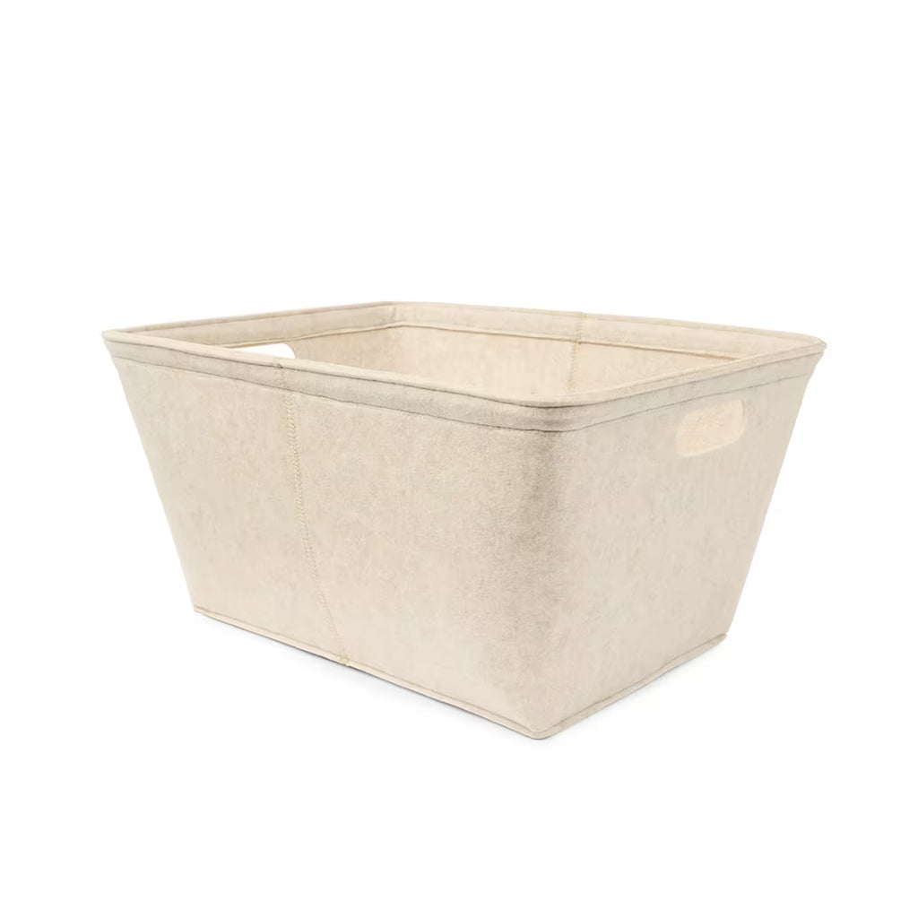 Lifestyle image beige felt storage tub in bedroom – storage solution
